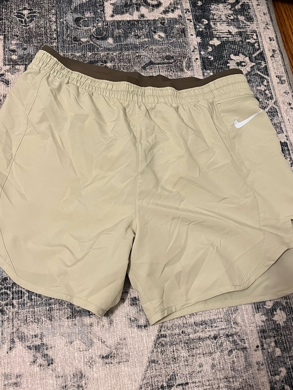 Nike Beige Athletic Shorts with Silver Swoosh